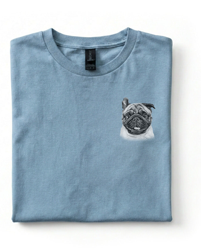 Folded blue t-shirt with a pug design on a white background