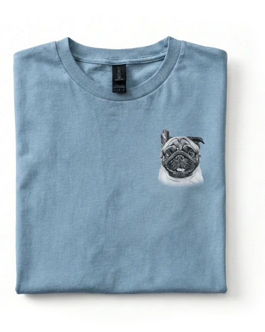 Folded blue t-shirt with a pug design on a white background