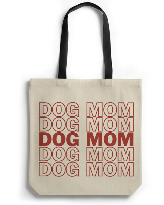 Beige tote bag with red text 'DOG DOG DOG MOM MOM MOM' on a white background