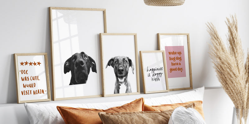 Memorial pet portraits displayed on bedroom wall in natural frames