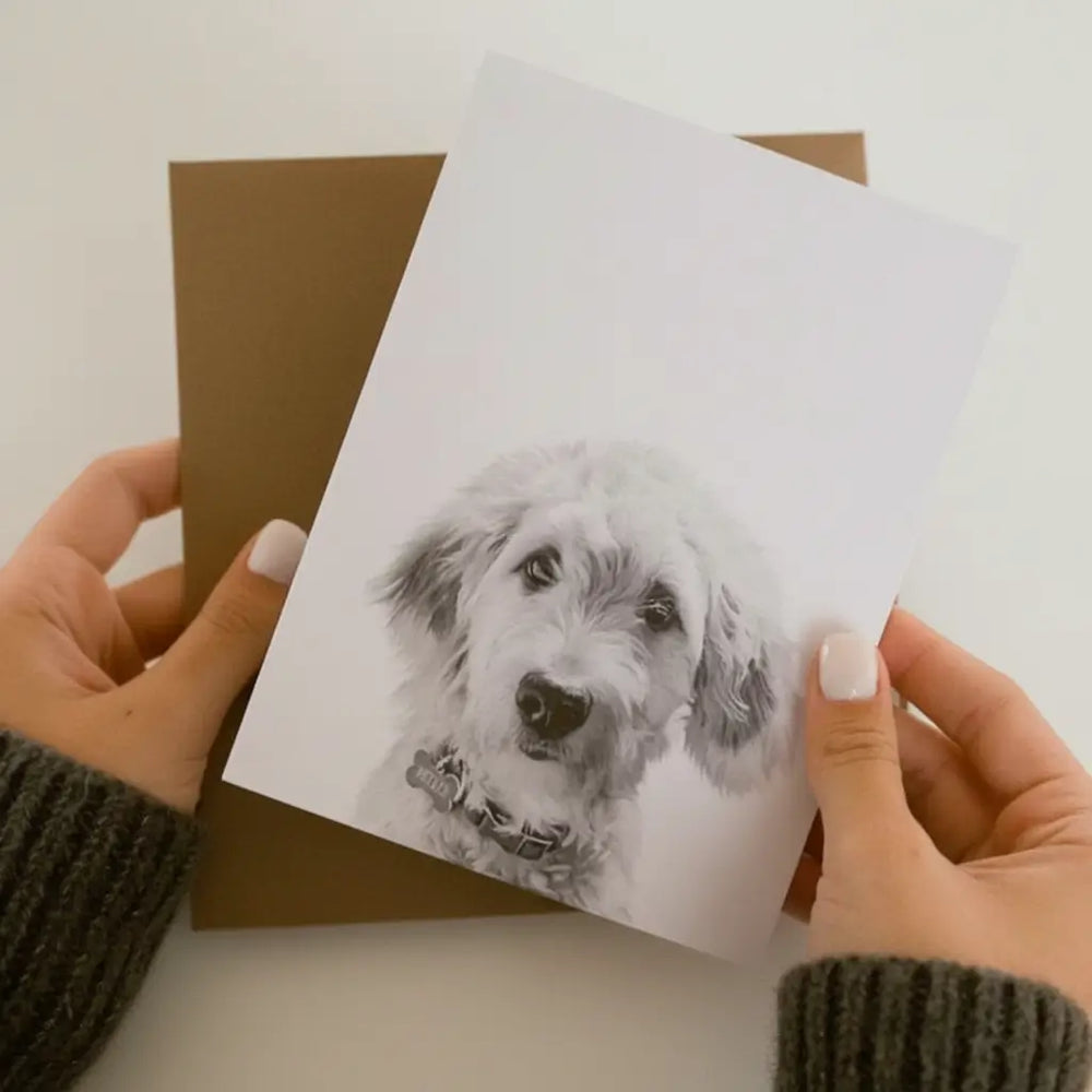 A Perkie Prints card and its envelope held in one hand