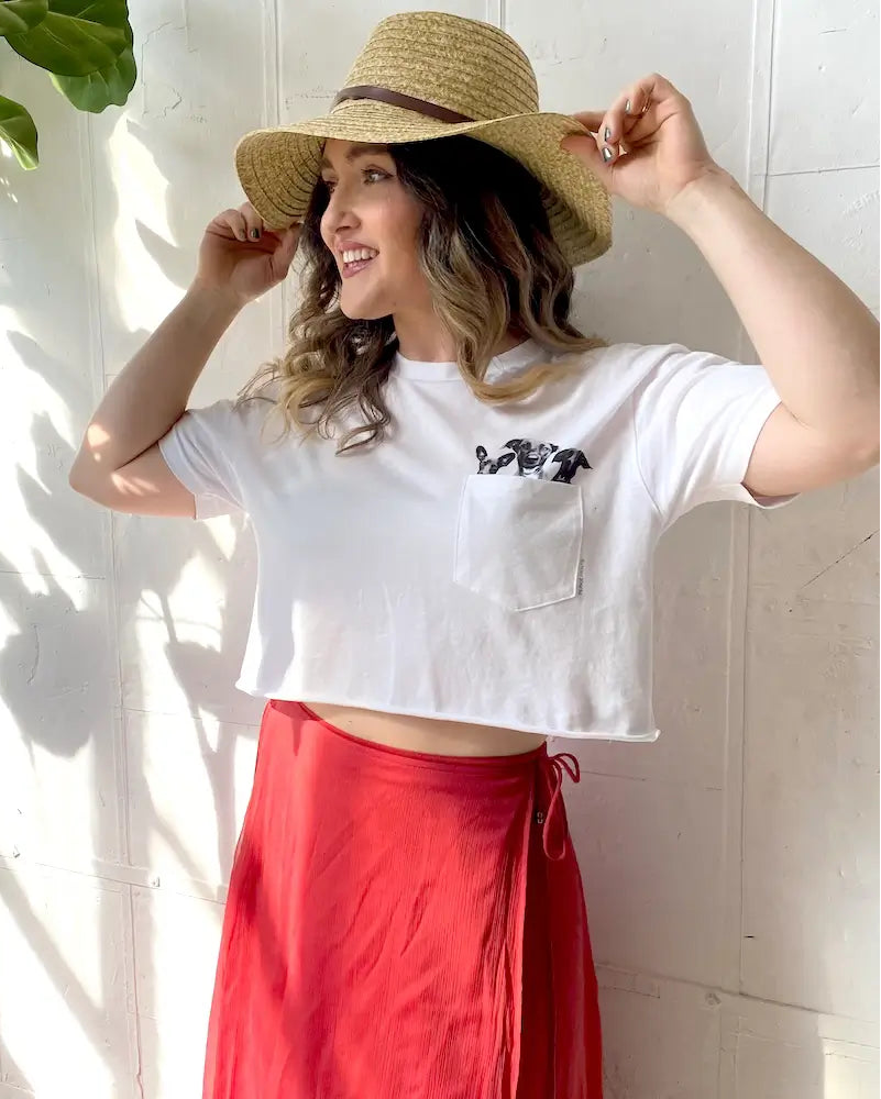 A pet parent wearing a Perkie Print pet-in-pocket tee