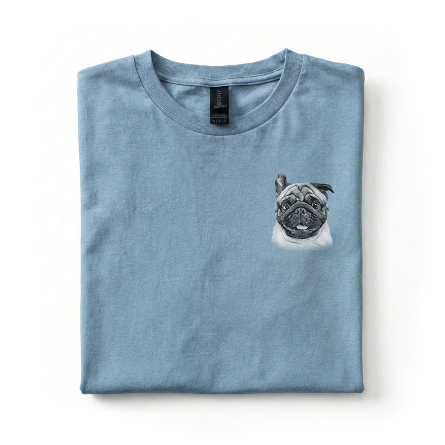 Folded blue t-shirt with a pug design on a white background