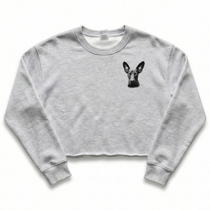 Gray cropped sweatshirt with a black dog illustration on a white background