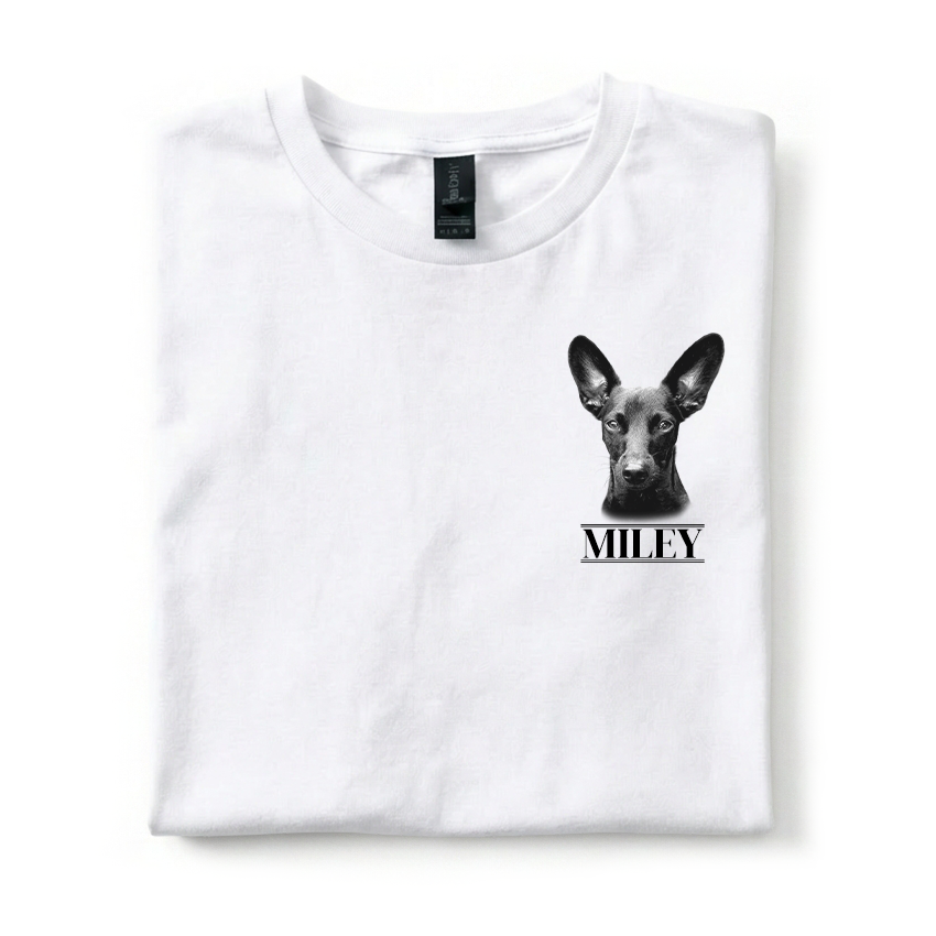 White t-shirt with a black and white dog illustration and 'MILEY' text on a white background