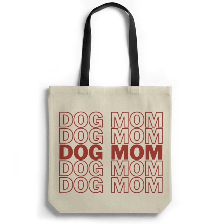 Beige tote bag with red text 'DOG DOG DOG MOM MOM MOM' on a white background
