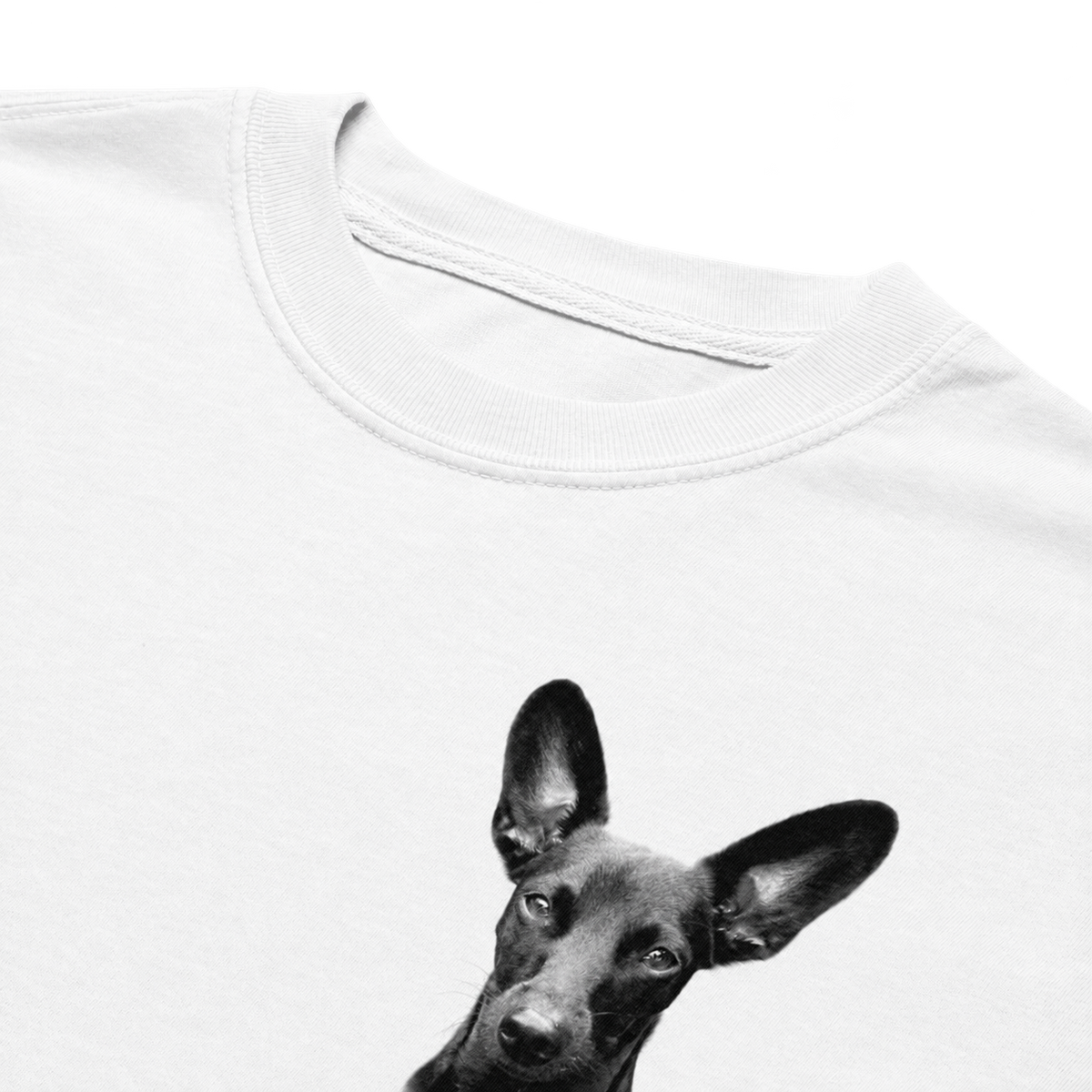 Close-up of a white crewneck t-shirt featuring a black and white graphic print of a dog's head on the front.