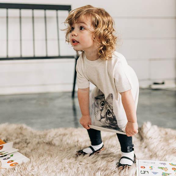 toddler loves large picture of cat on front of tee shirt