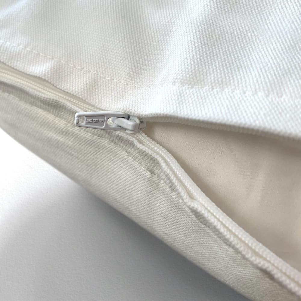 detail of zip throw pillow closure